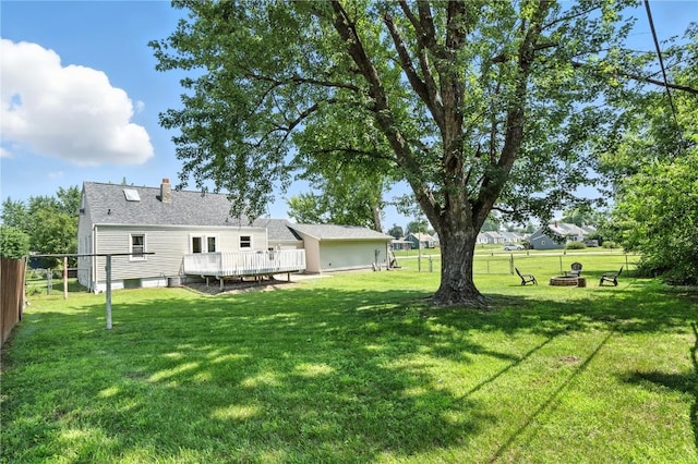 1039 27th St NE, Cedar Rapids, IA 52214 - view of yard featuring an outdoor fire pit and a wooden deck