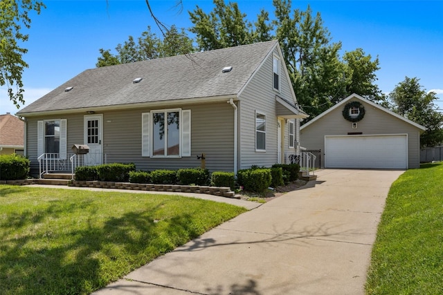 2226 Chandler SW, Cedar Rapids, IA 52404 - view of front facade featuring an outdoor structure, a detached garage, roof with shingles, and a front lawn