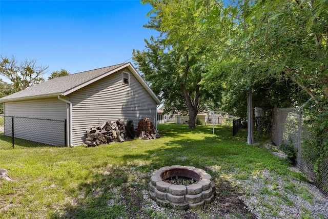2226 Chandler SW, Cedar Rapids, IA 52404 - fenced yard with an outdoor fire pit