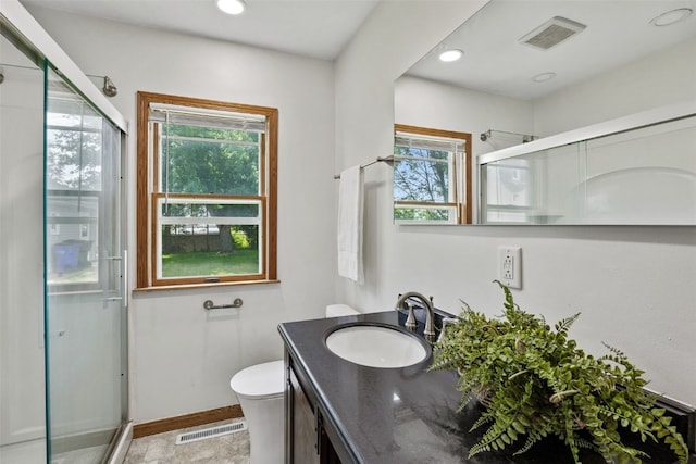 2226 Chandler SW, Cedar Rapids, IA 52404 - full bathroom featuring vanity, a shower stall, healthy amount of natural light, and recessed lighting
