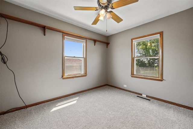 2226 Chandler SW, Cedar Rapids, IA 52404 - carpeted spare room with healthy amount of natural light and ceiling fan