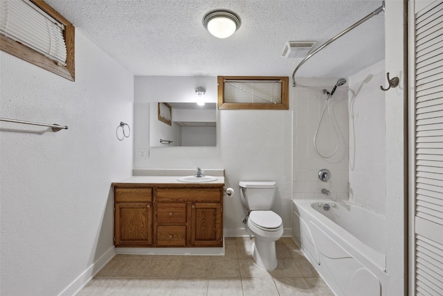 2226 Chandler SW, Cedar Rapids, IA 52404 - bathroom featuring vanity, tub / shower combination, a textured ceiling, and tile patterned floors