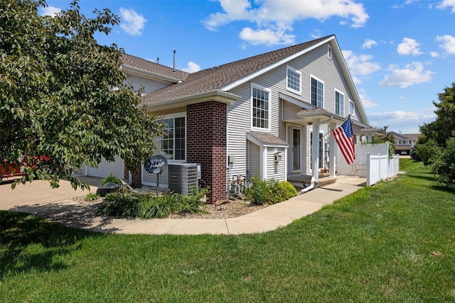 1167 74th St NE, Cedar Rapids, IA 52402 - view of property exterior with a shingled roof and brick siding