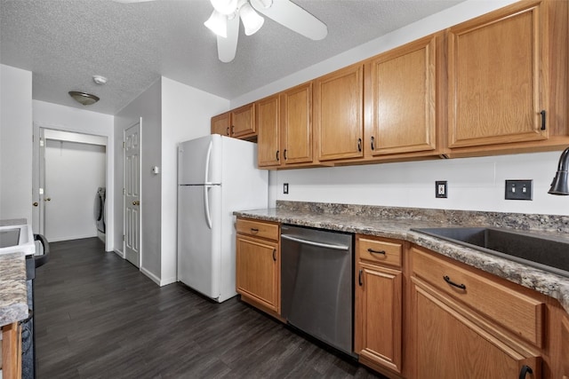 1167 74th St NE, Cedar Rapids, IA 52402 - kitchen featuring stainless steel dishwasher, dark wood-style floors, ceiling fan, brown cabinets, and a textured ceiling