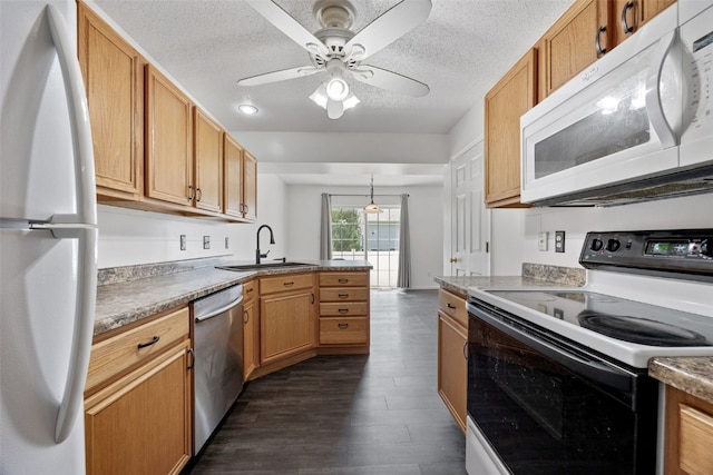 1167 74th St NE, Cedar Rapids, IA 52402 - kitchen with white appliances, a peninsula, dark wood-style floors, a ceiling fan, and a textured ceiling