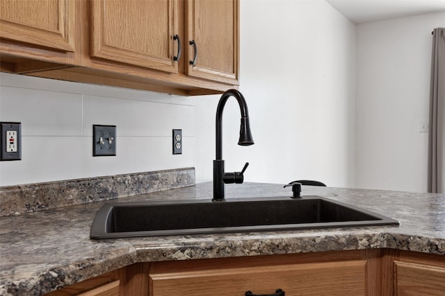 1167 74th St NE, Cedar Rapids, IA 52402 - kitchen view of a sink and dark countertops
