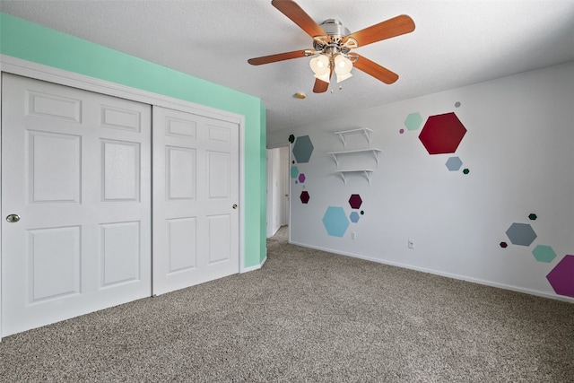 1167 74th St NE, Cedar Rapids, IA 52402 - unfurnished bedroom with carpet flooring, a closet, and a ceiling fan