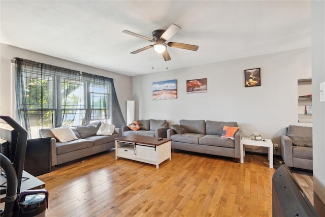 1638 47th St NE, Cedar Rapids, IA 52402 - living area with ceiling fan and light wood-style flooring