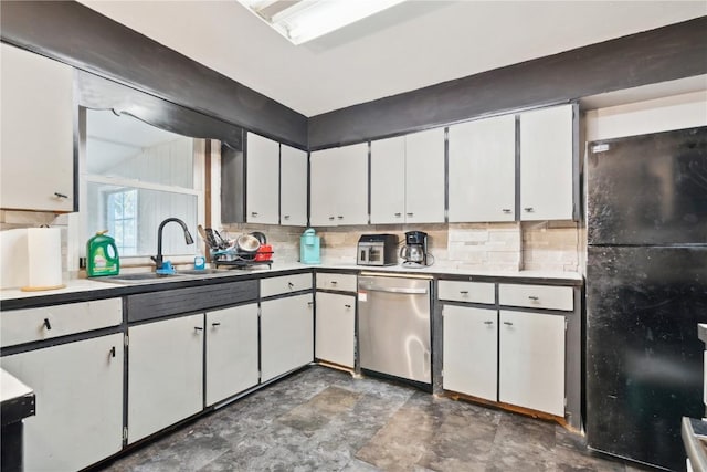 1638 47th St NE, Cedar Rapids, IA 52402 - kitchen featuring freestanding refrigerator, dishwasher, tasteful backsplash, and stone finish floors