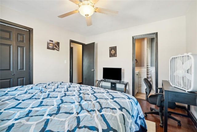 1638 47th St NE, Cedar Rapids, IA 52402 - bedroom with wood finished floors, a ceiling fan, an office area, and connected bathroom