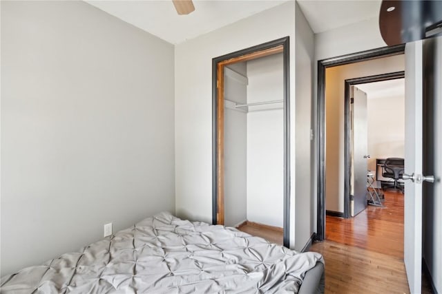 1638 47th St NE, Cedar Rapids, IA 52402 - bedroom featuring wood finished floors, a closet, and ceiling fan