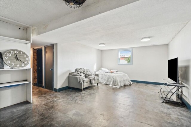 1638 47th St NE, Cedar Rapids, IA 52402 - bedroom with a textured ceiling and baseboards