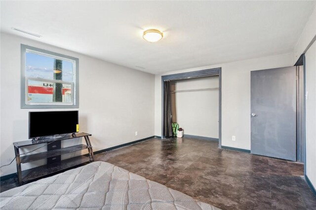 1638 47th St NE, Cedar Rapids, IA 52402 - bedroom with a closet and concrete flooring