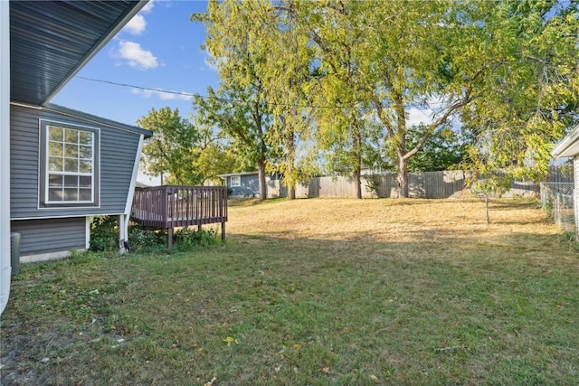 1638 47th St NE, Cedar Rapids, IA 52402 - fenced yard featuring a wooden deck