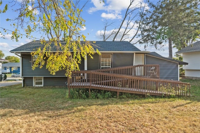 1638 47th St NE, Cedar Rapids, IA 52402 - rear view of property featuring a yard and a wooden deck