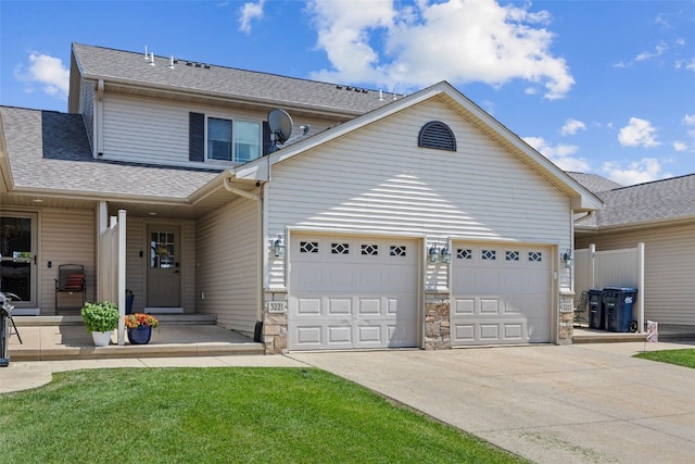 3221 English Cove Ln, Marion, IA 52302 - traditional-style home with an attached garage, a shingled roof, driveway, and stone siding