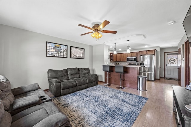 3221 English Cove Ln, Marion, IA 52302 - living area with ceiling fan and wood finished floors
