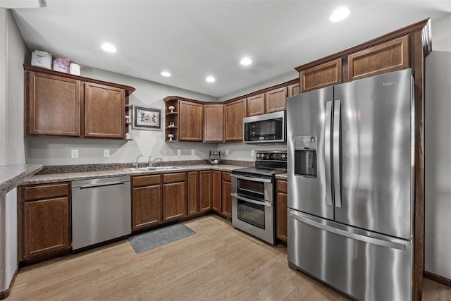 3221 English Cove Ln, Marion, IA 52302 - kitchen featuring stainless steel appliances, open shelves, light wood finished floors, and recessed lighting