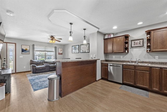 3221 English Cove Ln, Marion, IA 52302 - kitchen with open shelves, open floor plan, a peninsula, light wood-style flooring, and stainless steel dishwasher