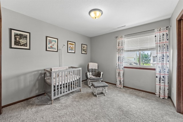 3221 English Cove Ln, Marion, IA 52302 - bedroom featuring carpet floors and a nursery area
