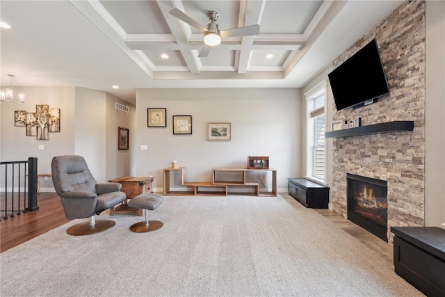 1627 Settlers Dr, Marion, IA 52302 - sitting room featuring a ceiling fan, beamed ceiling, coffered ceiling, carpet flooring, and a chandelier