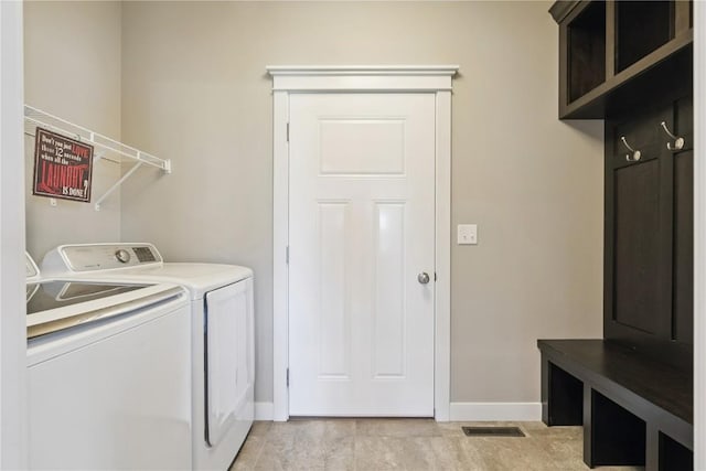 1627 Settlers Dr, Marion, IA 52302 - laundry area featuring independent washer and dryer and cabinet space