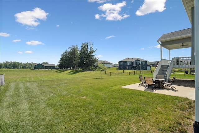 1627 Settlers Dr, Marion, IA 52302 - view of yard with a patio, stairs, and a ceiling fan