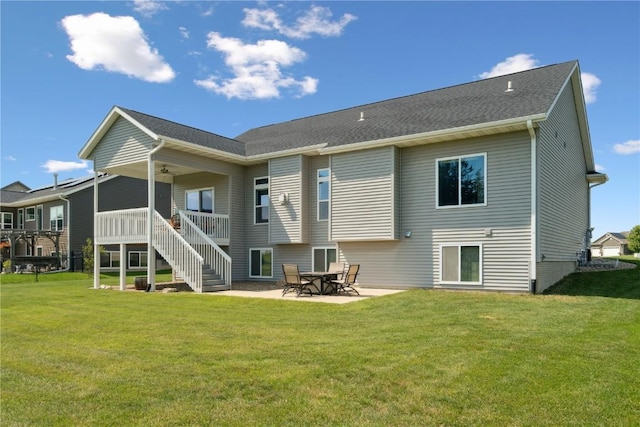 1627 Settlers Dr, Marion, IA 52302 - back of property with a lawn, stairway, a patio, and ceiling fan