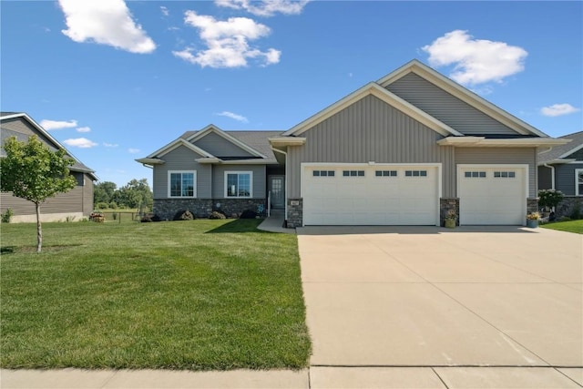1627 Settlers Dr, Marion, IA 52302 - craftsman-style house featuring stone siding, concrete driveway, an attached garage, and a front lawn