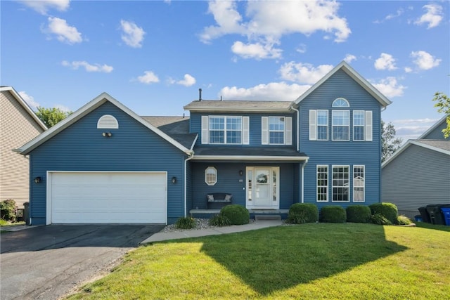 405 Stoney Creek Rd NW, Cedar Rapids, IA 52405 - traditional-style house with asphalt driveway, a front yard, covered porch, and an attached garage
