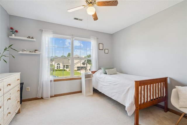 405 Stoney Creek Rd NW, Cedar Rapids, IA 52405 - bedroom featuring light colored carpet and ceiling fan