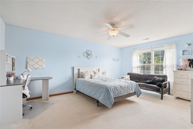 405 Stoney Creek Rd NW, Cedar Rapids, IA 52405 - bedroom featuring carpet flooring, an office area, ceiling fan, and a textured ceiling