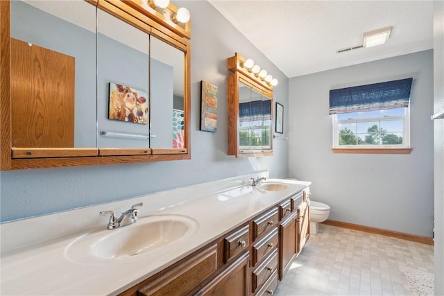 405 Stoney Creek Rd NW, Cedar Rapids, IA 52405 - bathroom featuring double vanity and tile patterned floors
