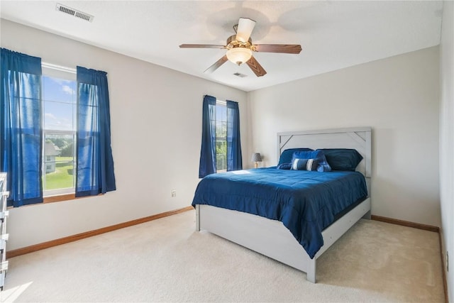 405 Stoney Creek Rd NW, Cedar Rapids, IA 52405 - bedroom with carpet floors and ceiling fan