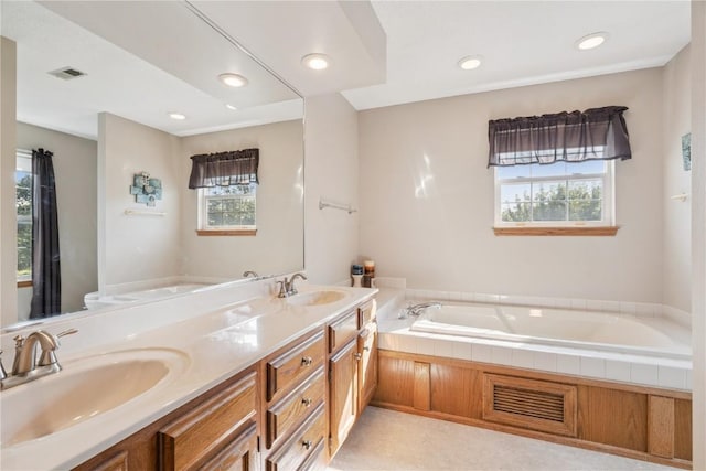 405 Stoney Creek Rd NW, Cedar Rapids, IA 52405 - full bathroom with a bath, double vanity, and recessed lighting