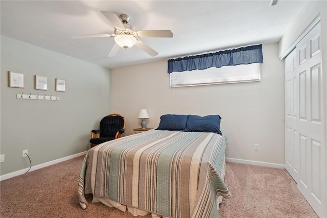 405 Stoney Creek Rd NW, Cedar Rapids, IA 52405 - bedroom with carpet, a closet, and a ceiling fan