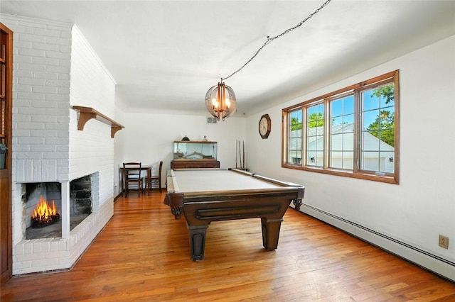 2153 Echo Hill Rd, Marion, IA 52302 - recreation room with hardwood / wood-style floors, a baseboard radiator, a fireplace, and pool table