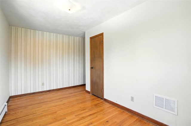 2153 Echo Hill Rd, Marion, IA 52302 - empty room with light wood-style floors and a baseboard radiator