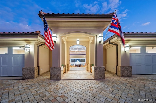 patio terrace at dusk with a garage