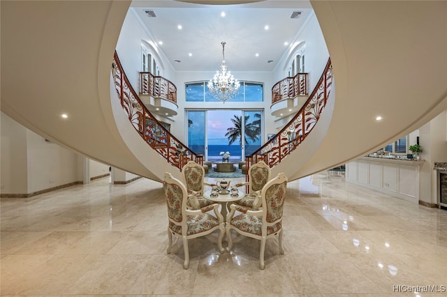 interior space featuring crown molding and a chandelier