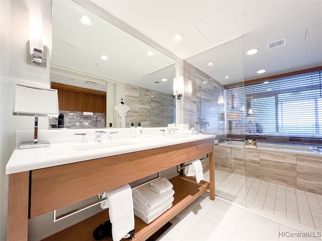 bathroom featuring vanity, plus walk in shower, and tile patterned floors