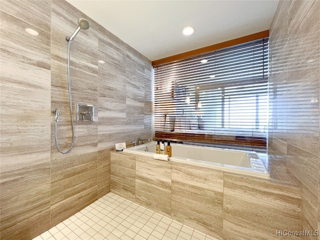 bathroom featuring tile walls, separate shower and tub, and tile patterned floors