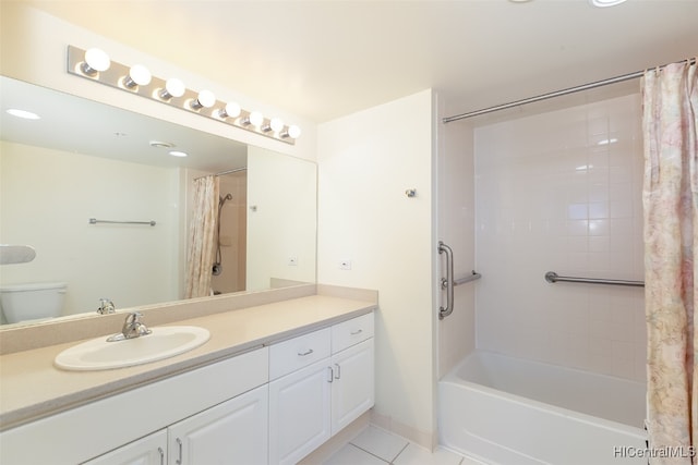 full bathroom featuring toilet, shower / bath combo with shower curtain, vanity, and tile patterned flooring