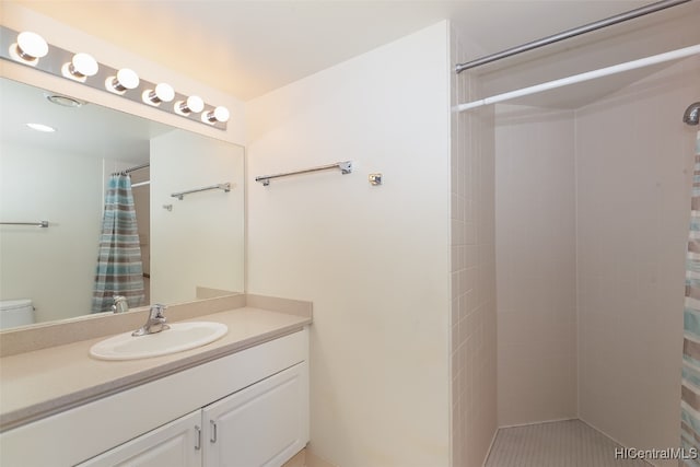 bathroom with vanity, a shower with curtain, and toilet