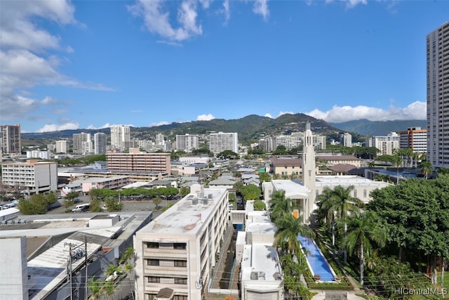 property's view of city featuring a mountain view