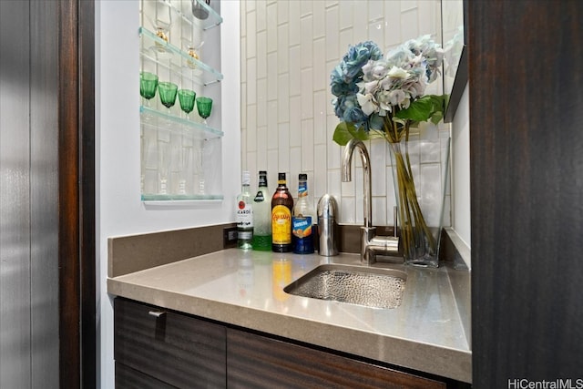 interior space featuring dark brown cabinetry and sink