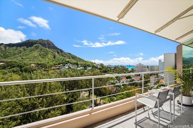 balcony featuring a mountain view