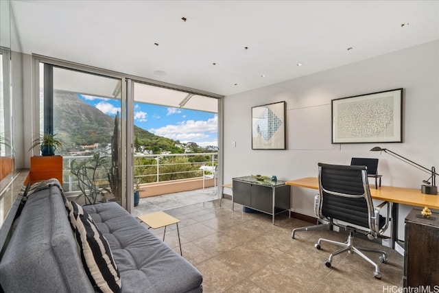 home office with expansive windows and light tile patterned floors