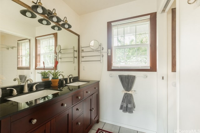 bathroom featuring vanity, plenty of natural light, and tile patterned flooring