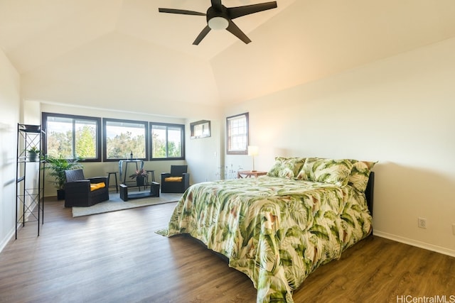 bedroom featuring dark wood-type flooring, ceiling fan, and high vaulted ceiling